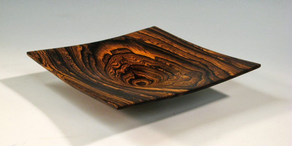 Wooden bowl with swirling grain pattern