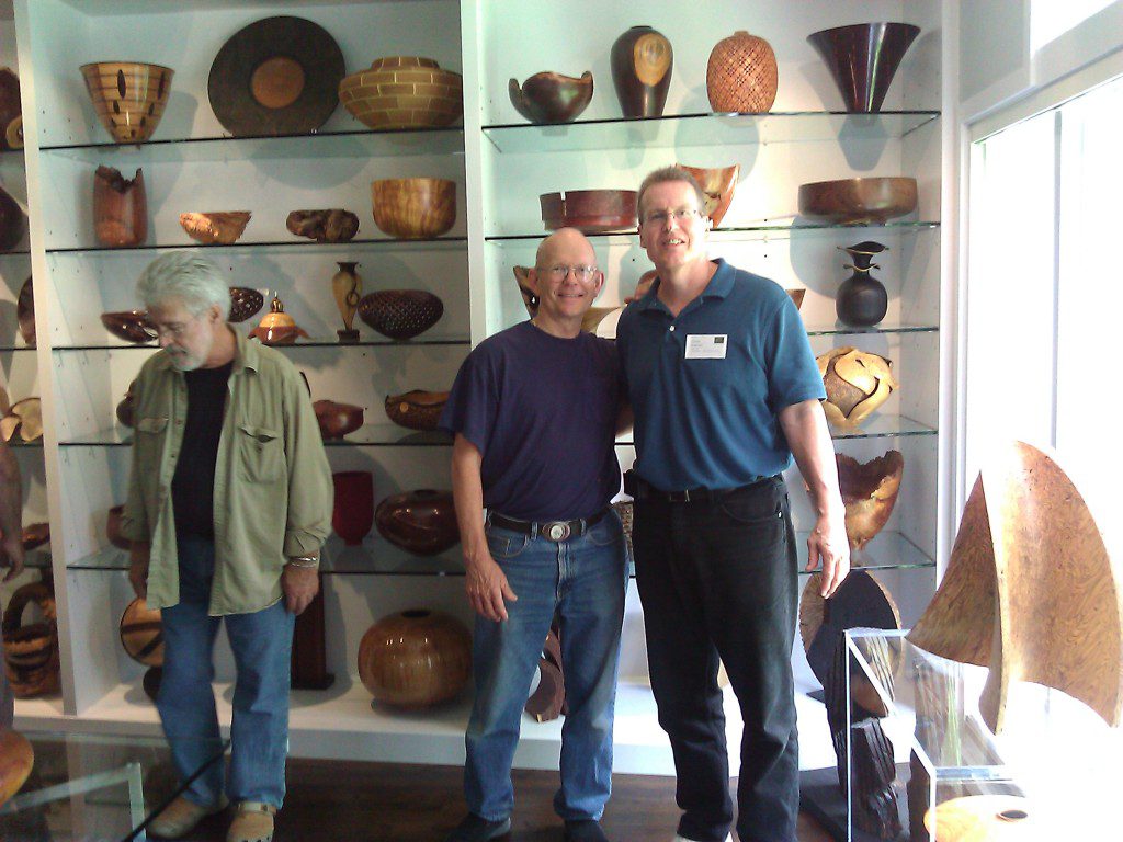 Visitors in a wooden art exhibit